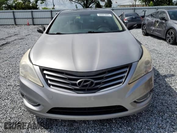 2013 Hyundai Azera z VIN KMHFH4JG1DA230468, wystawiony jako Copart lot #68003885 z przebiegiem 147 684 mil mil oraz Szkoda całkowita • Salvage title. Historia ofert i sprzedaży dostępna na DreamBid. Obrazek 5.