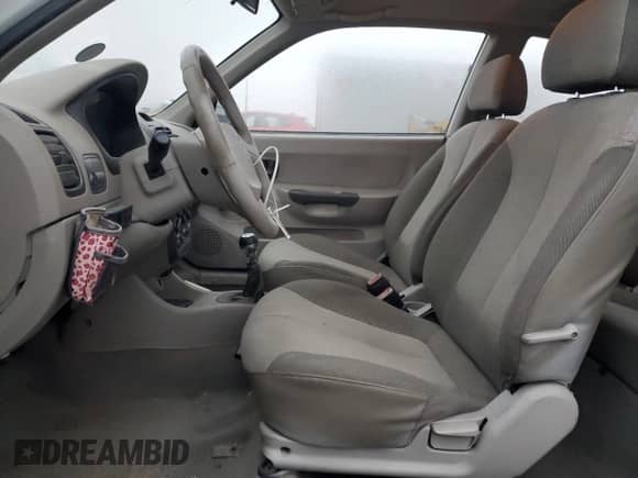 2002 Hyundai Accent z VIN KMHCF35G52U207137, wystawiony jako Copart lot #82818574 z przebiegiem 185 177 mil mil oraz Szkoda całkowita • Salvage title. Historia ofert i sprzedaży dostępna na DreamBid. Obrazek 7.