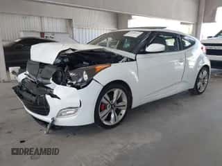 2014 Hyundai Veloster z VIN KMHTC6AD0EU193142, wystawiony jako IAAI lot #43464437 z przebiegiem 66 340 mil mil oraz . Historia ofert i sprzedaży dostępna na DreamBid. Obrazek 2.