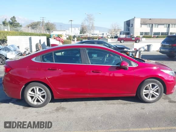 2018 Chevrolet Cruze LT with VIN 1G1BH5SE7J7189433, listed as a IAAI auction lot 41644135 with 141,714 mi miles and . Bid and sale history available at DreamBid. Image 13.