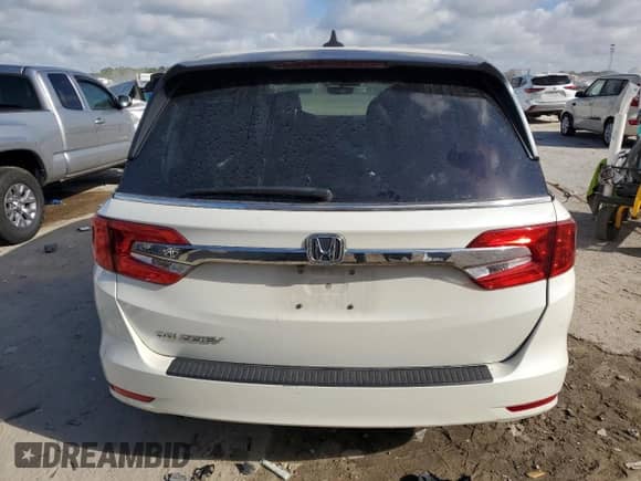 2019 Honda Odyssey EX-L with VIN 5FNRL6H76KB083330, listed as a Copart auction lot 82127835 with 97,880 mi miles and Salvage title. Bid and sale history available at DreamBid. Image 6.