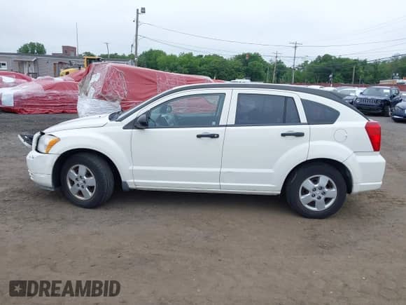 2008 Dodge Caliber SE with VIN 1B3HB28B28D625598, listed as a IAAI auction lot 42449035 with 125,987 mi miles and . Bid and sale history available at DreamBid. Image 14.