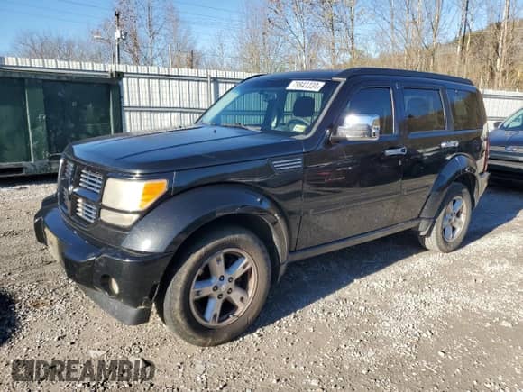 2011 Dodge Nitro SXT z VIN 1D4PU5GK5BW575754, wystawiony jako Copart lot #79841234 z przebiegiem 246 589 mil mil oraz Szkoda całkowita • Salvage title. Historia ofert i sprzedaży dostępna na DreamBid. Obrazek 1.