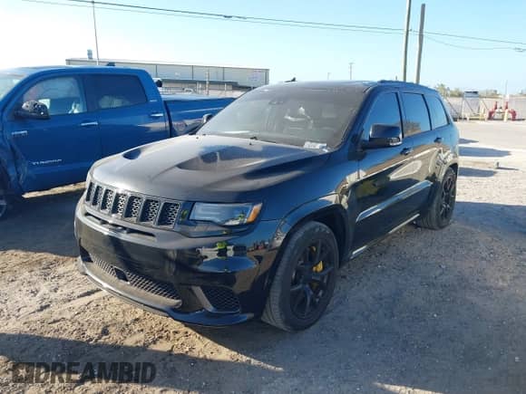 2018 Jeep Grand Cherokee Trackhawk z VIN 1C4RJFN95JC283798, wystawiony jako IAAI lot #40739384 z przebiegiem 54 065 mil mil oraz . Historia ofert i sprzedaży dostępna na DreamBid. Obrazek 2.