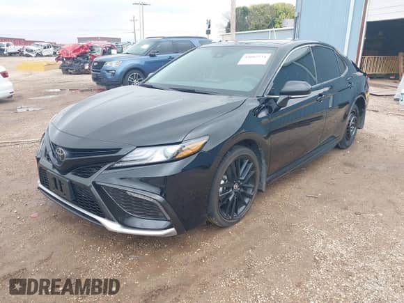 2023 Toyota Camry XSE with VIN 4T1K61AK4PU828838, listed as a IAAI auction lot 43087534 with 19,542 mi miles and . Bid and sale history available at DreamBid. Image 2.