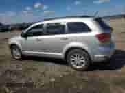 2013 Dodge Journey SXT z VIN 3C4PDCBG1DT560844, wystawiony jako Copart lot #84458555 z przebiegiem 161 542 mil mil oraz Szkoda całkowita • Salvage title. Historia ofert i sprzedaży dostępna na DreamBid. Obrazek 2.