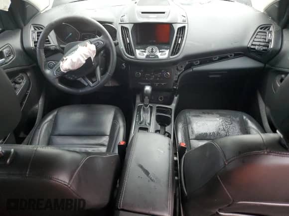 2017 Ford Escape Titanium с VIN 1FMCU0J97HUF08576, выставлен на аукционе Copart как лот 72013245 с пробегом 65 563 миль миль и Списание • Salvage title. История ставок и продаж доступна на DreamBid. Изображение 8.