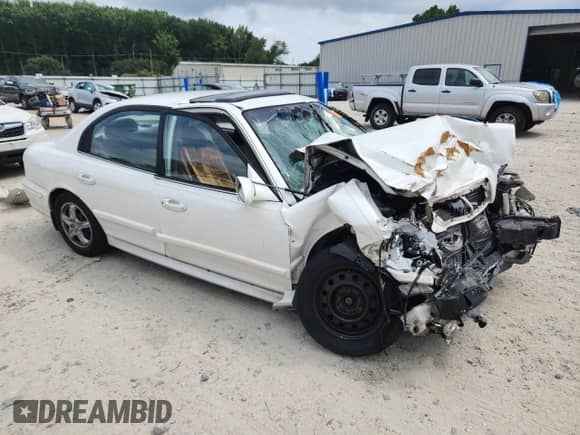 2002 Hyundai Sonata z VIN KMHWF25S92A695845, wystawiony jako Copart lot #69102555 z przebiegiem 199 422 mil mil oraz Szkoda całkowita • Salvage title. Historia ofert i sprzedaży dostępna na DreamBid. Obrazek 4.