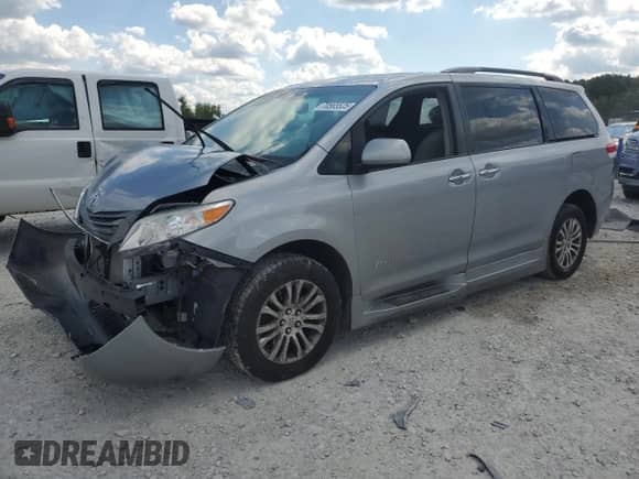 2012 Toyota Sienna XLE with VIN 5TDYK3DC6CS235796, listed as a Copart auction lot 70565525 with 120,990 mi miles and Clean title. Bid and sale history available at DreamBid. Image 1.