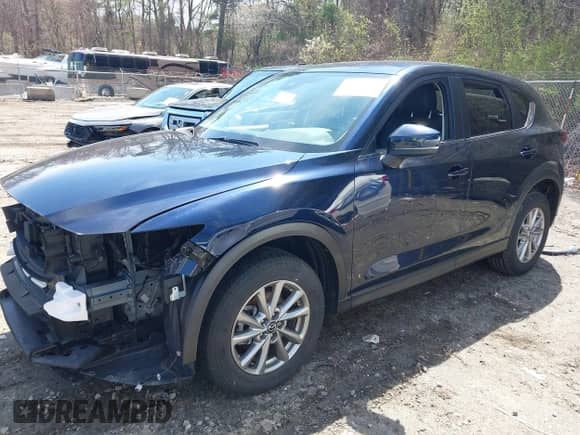 2022 Mazda CX-5 S Select z VIN JM3KFBBM8N0633363, wystawiony jako IAAI lot #42064278 z przebiegiem 69 226 mil mil oraz . Historia ofert i sprzedaży dostępna na DreamBid. Obrazek 2.