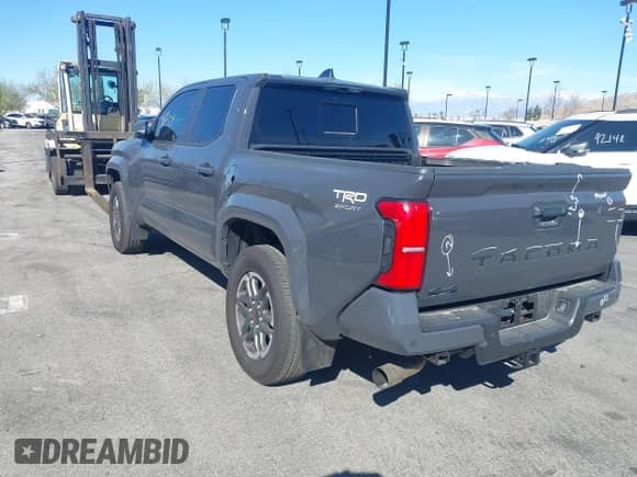2024 Toyota Tacoma SR5 with VIN 3TMLB5JN5RM051339, listed as a IAAI auction lot 41241754 with 7,181 mi miles and . Bid and sale history available at DreamBid. Image 3.