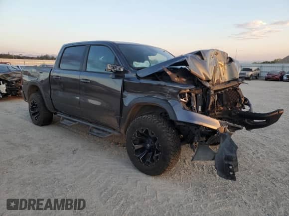2019 Ram 1500 Rebel z VIN 1C6SRFLT6KN672164, wystawiony jako Copart lot #70311105 z przebiegiem 120 085 mil mil oraz Szkoda całkowita • Salvage title. Historia ofert i sprzedaży dostępna na DreamBid. Obrazek 4.