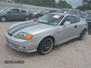 2004 Hyundai Tiburon GT с VIN KMHHN65F74U127696, выставлен на аукционе IAAI как лот 42126095 с пробегом 159 902 миль миль и . История ставок и продаж доступна на DreamBid. Изображение 2.