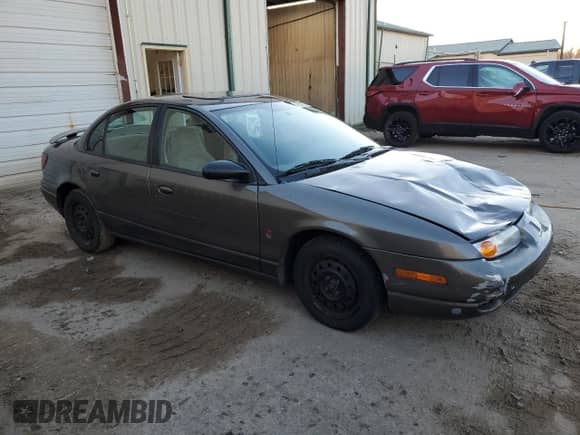 2000 Saturn SL with VIN 1G8ZJ5274YZ256204, listed as a Copart auction lot 79502124 with 190,120 mi miles and Salvage title. Bid and sale history available at DreamBid. Image 4.
