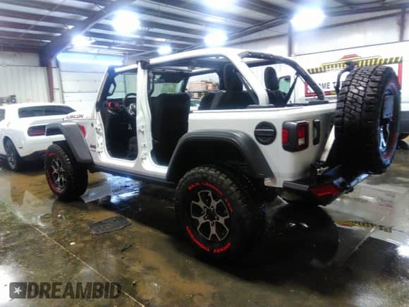 2021 Jeep Wrangler Unlimited Rubicon with VIN 1C4HJXFN9MW779882, listed as a IAAI auction lot 37264183 with 36,314 mi miles and . Bid and sale history available at DreamBid. Image 3.