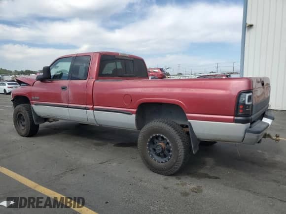 1999 Dodge 2500 with VIN 3B7KF2369XG173993, listed as a Copart auction lot 71192525 with 213,711 mi miles and Salvage title. Bid and sale history available at DreamBid. Image 2.