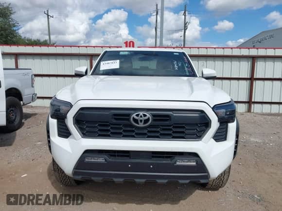 2025 Toyota Tacoma SR with VIN 3TMLB5JN8SM105447, listed as a IAAI auction lot 43487043 with 13,994 mi miles and . Bid and sale history available at DreamBid. Image 12.
