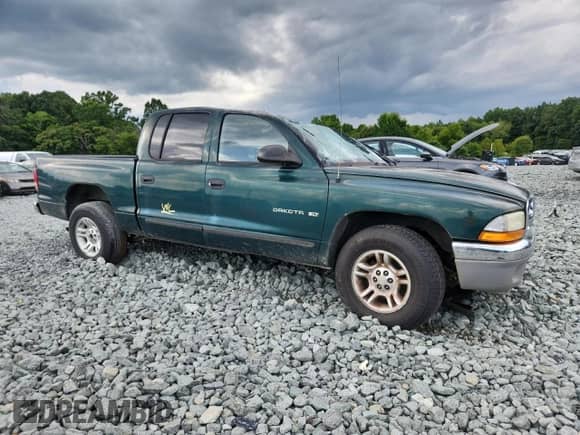2001 Dodge Dakota Sport with VIN 1B7HL2AX11S287503, listed as a Copart auction lot 65212095 with Not provided miles and Salvage title. Bid and sale history available at DreamBid. Image 4.