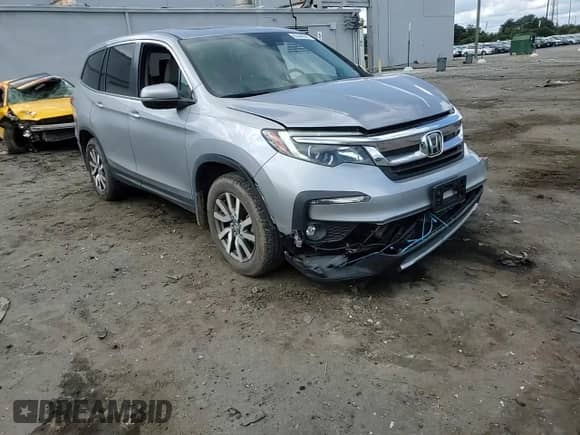 2022 Honda Pilot EX-L with VIN 5FNYF6H54NB021107, listed as a Copart auction lot 80446585 with 61,122 mi miles and Salvage title. Bid and sale history available at DreamBid. Image 14.