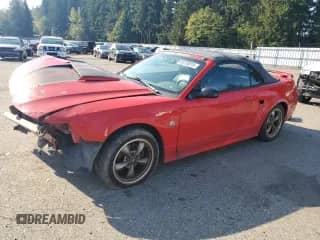 2004 Ford Mustang GT Deluxe с VIN 1FAFP45X04F239320, выставлен на аукционе Copart как лот 85730015 с пробегом 191 245 миль миль и Списание • Salvage title. История ставок и продаж доступна на DreamBid. Изображение 1.