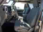 2024 Jeep Wrangler Willys with VIN 1C4RJXDG9RW286042, listed as a Copart auction lot 49459025 with 6,417 mi miles and Salvage title. Bid and sale history available at DreamBid. Image 7.