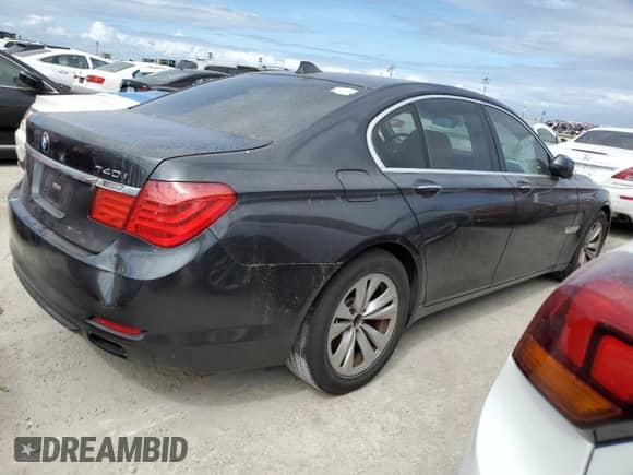 2011 BMW 7 Series 740i with VIN WBAKA4C51BC612517, listed as a Copart auction lot 76987474 with Not provided miles and Salvage title. Bid and sale history available at DreamBid. Image 3.