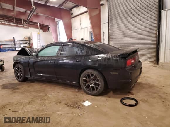 2013 Dodge Charger SXT с VIN 2C3CDXHG7DH705704, выставлен на аукционе Copart как лот 82070115 с пробегом 211 001 миль миль и Списание • Salvage title. История ставок и продаж доступна на DreamBid. Изображение 2.