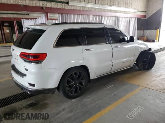 2014 Jeep Grand Cherokee Summit с VIN 1C4RJFJG3EC378404, выставлен на аукционе Copart как лот 69317825 с пробегом 149 425 миль миль и На запчасти • Non repairable. История ставок и продаж доступна на DreamBid. Изображение 3.