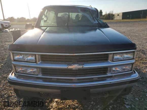 1995 Chevrolet Tahoe with VIN 3GNEK18K7SG119164, listed as a Copart auction lot 77744684 with 165,798 mi miles and Salvage title. Bid and sale history available at DreamBid. Image 5.