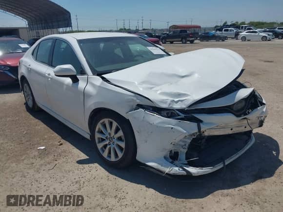 2018 Toyota Camry SE z VIN 4T1B11HK0JU023012, wystawiony jako IAAI lot #43142534 z przebiegiem 122 170 mil mil oraz . Historia ofert i sprzedaży dostępna na DreamBid. Obrazek 1.