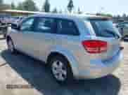 2013 Dodge Journey SE z VIN 3C4PDCAB3DT552847, wystawiony jako IAAI lot #42409901 z przebiegiem 97 482 mil mil oraz . Historia ofert i sprzedaży dostępna na DreamBid. Obrazek 3.