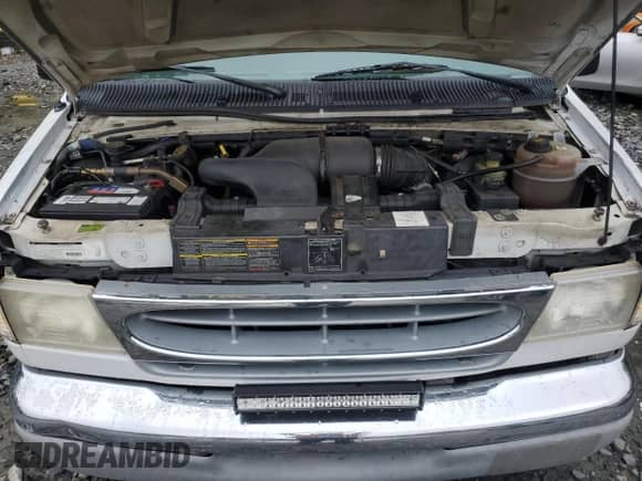 2000 Ford Econoline Cargo Recreational with VIN 1FDRE14L3YHA17676, listed as a Copart auction lot 58571465 with 174,129 mi miles and Salvage title. Bid and sale history available at DreamBid. Image 12.