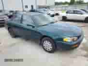 1996 Toyota Camry DX z VIN 4T1BG12K0TU771270, wystawiony jako Copart lot #64760345 z przebiegiem 198 961 mil mil oraz Nie do naprawy • Non repairable. Historia ofert i sprzedaży dostępna na DreamBid. Obrazek 4.