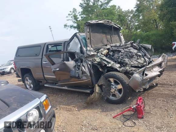 2015 Chevrolet Silverado 2500HD High Country with VIN 1GC1KXE8XFF614341, listed as a IAAI auction lot 43154911 with Not provided miles and . Bid and sale history available at DreamBid. Image 14.