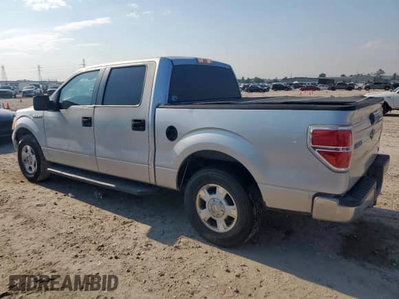 2010 Ford F-150 XL with VIN 1FTFW1CVXAKC36778, listed as a Copart auction lot 70321355 with 201,155 mi miles and Salvage title. Bid and sale history available at DreamBid. Image 2.