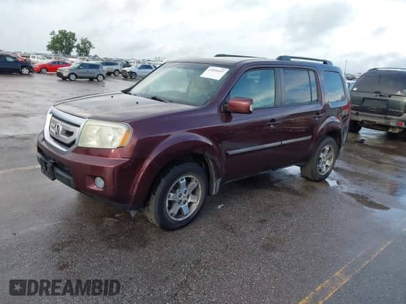 2009 Honda Pilot Touring with VIN 5FNYF38819B022195, listed as a IAAI auction lot 42850497 with 192,072 mi miles and . Bid and sale history available at DreamBid. Image 2.
