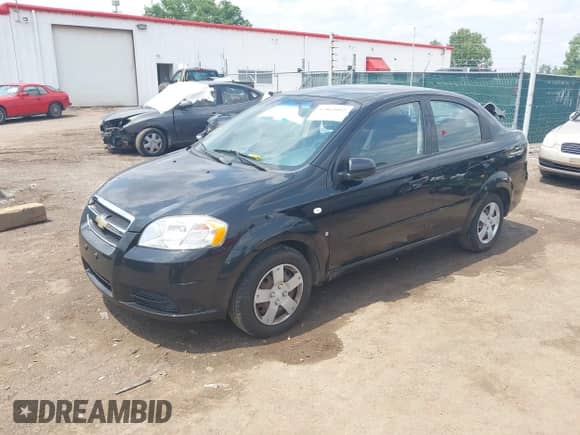 2007 Chevrolet Aveo LS with VIN KL1TD56627B055436, listed as a IAAI auction lot 42462092 with 102,923 mi miles and . Bid and sale history available at DreamBid. Image 2.