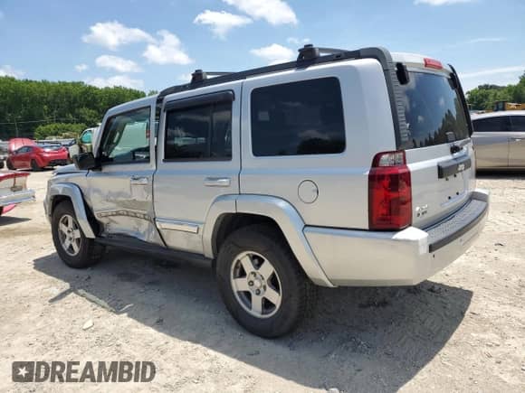 2010 Jeep Commander Sport with VIN 1J4RG4GK5AC121781, listed as a Copart auction lot 59873605 with 159,444 mi miles and Salvage title. Bid and sale history available at DreamBid. Image 2.
