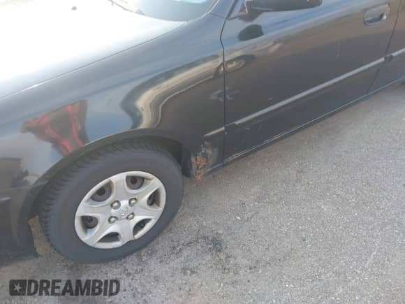 2005 Hyundai Accent GLS z VIN KMHCG45C55U587584, wystawiony jako IAAI lot #42864972 z przebiegiem 122 849 mil mil oraz . Historia ofert i sprzedaży dostępna na DreamBid. Obrazek 6.