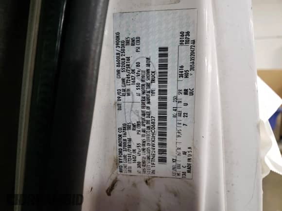 2003 Ford Econoline Cargo z VIN 1FTNE24WX3HC06837, wystawiony jako Copart lot #87386044 z przebiegiem 207 059 mil mil oraz Szkoda całkowita • Salvage title. Historia ofert i sprzedaży dostępna na DreamBid. Obrazek 13.