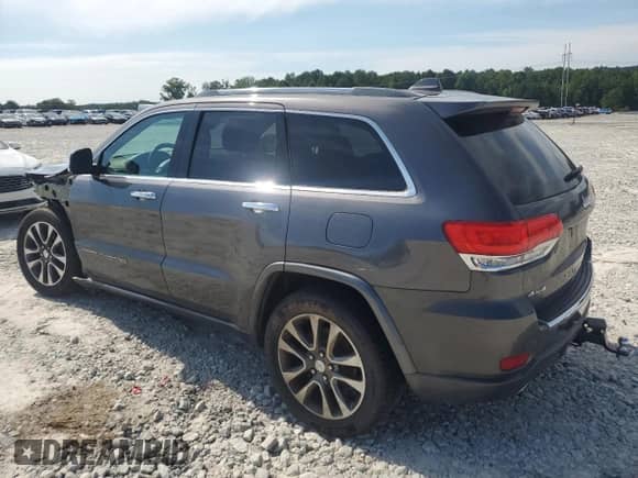 2017 Jeep Grand Cherokee Overland with VIN 1C4RJFCG9HC800659, listed as a Copart auction lot 67804285 with 105,483 mi miles and Salvage title. Bid and sale history available at DreamBid. Image 2.