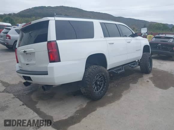 2015 Chevrolet Suburban LT with VIN 1GNSKJKC5FR591115, listed as a IAAI auction lot 43445461 with 126,794 mi miles and . Bid and sale history available at DreamBid. Image 4.