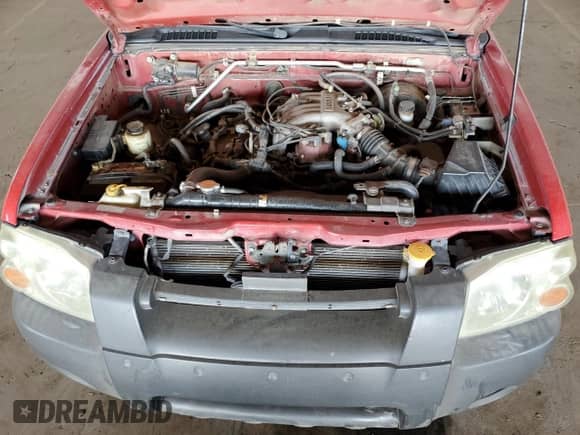 2002 Nissan Frontier XE with VIN 1N6ED26T52C341691, listed as a Copart auction lot 52446055 with 271,761 mi miles and Salvage title. Bid and sale history available at DreamBid. Image 11.