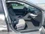 2021 Toyota Camry Hybrid XLE with VIN 4T1F31AK5MU565376, listed as a IAAI auction lot 42687616 with 57,880 mi miles and . Bid and sale history available at DreamBid. Image 5.