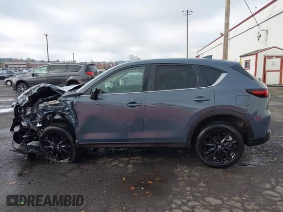 2023 Mazda CX-5 S Carbon Edition z VIN JM3KFBCM2P0212062, wystawiony jako IAAI lot #40853928 z przebiegiem 25 463 mil mil oraz . Historia ofert i sprzedaży dostępna na DreamBid. Obrazek 14.