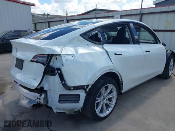 2023 Tesla Model Y Long Range with VIN 7SAYGDEE6PA078790, listed as a IAAI auction lot 43261075 with 20,370 mi miles and . Bid and sale history available at DreamBid. Image 4.