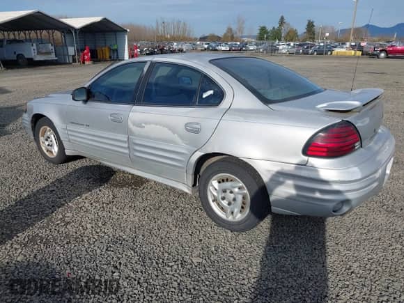 2001 Pontiac Grand Am SE1 with VIN 1G2NF52TX1M560650, listed as a IAAI auction lot 41654339 with 122,885 mi miles and . Bid and sale history available at DreamBid. Image 3.