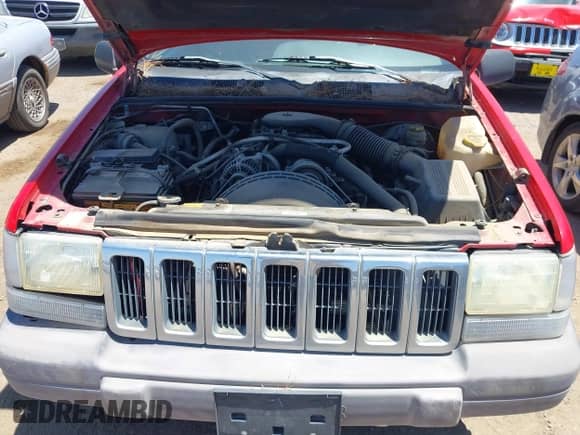 1996 Jeep Grand Cherokee Laredo z VIN 1J4GZ58Y5TC183677, wystawiony jako IAAI lot #42582989 z przebiegiem 187 453 mil mil oraz . Historia ofert i sprzedaży dostępna na DreamBid. Obrazek 10.