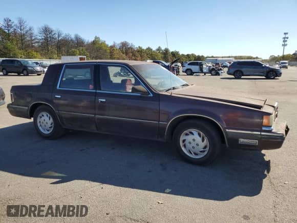 1989 Dodge Dynasty with VIN 1B3BC4637KD532206, listed as a Copart auction lot 74233744 with 85,245 mi miles and Clean title. Bid and sale history available at DreamBid. Image 4.