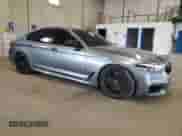 2018 BMW 5 Series M550i xDrive with VIN WBAJB9C51JB034817, listed as a Copart auction lot 69056245 with 132,405 mi miles and Salvage title. Bid and sale history available at DreamBid. Image 4.